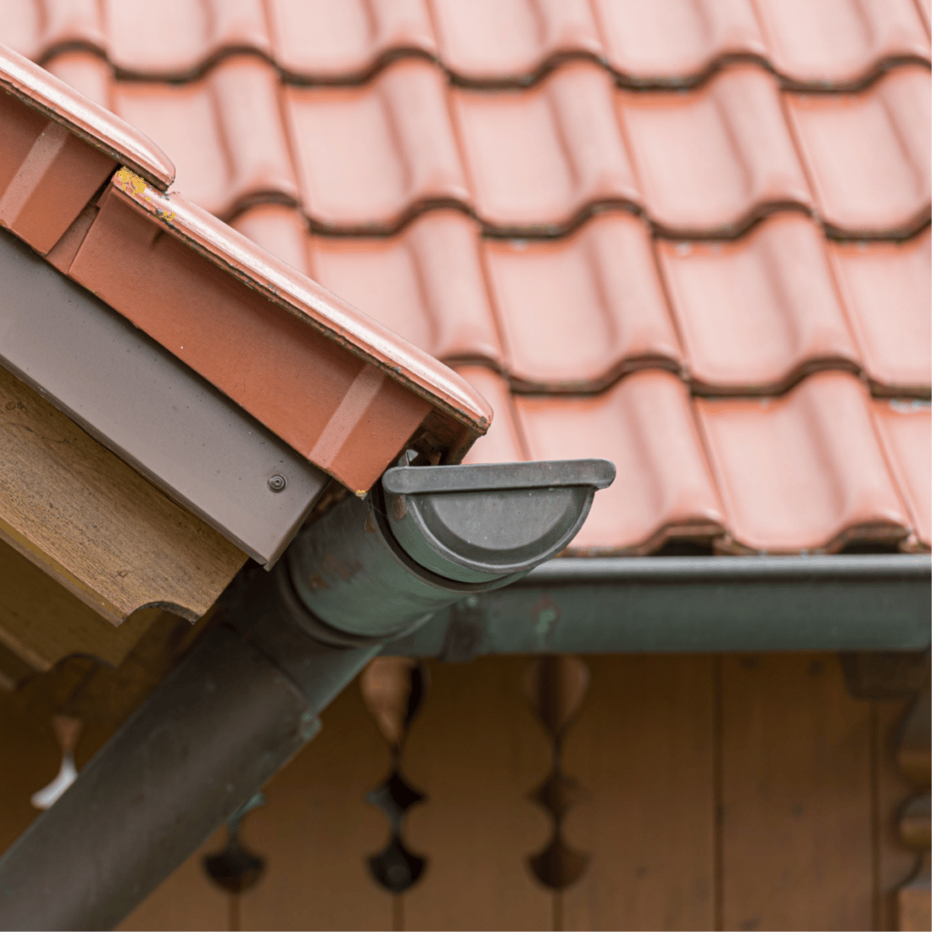 closeup of tile roof and gutters