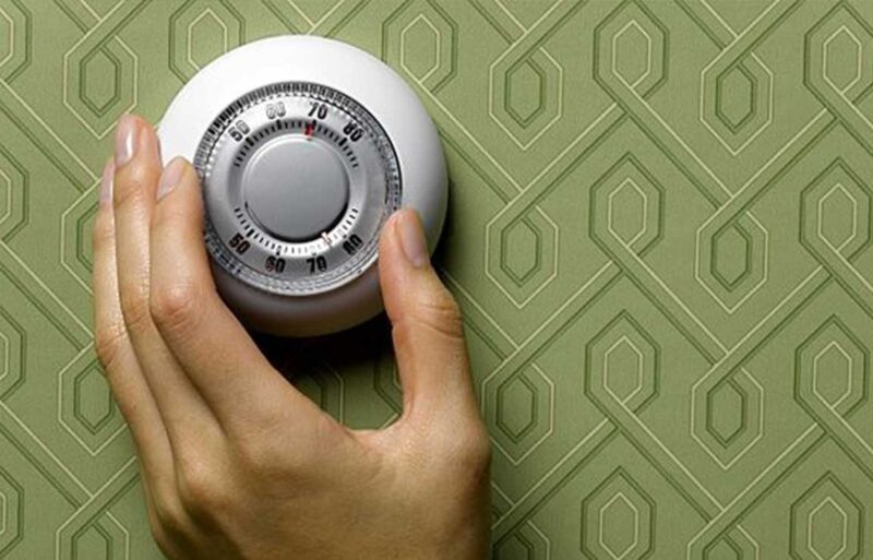 hand adjusting thermostat