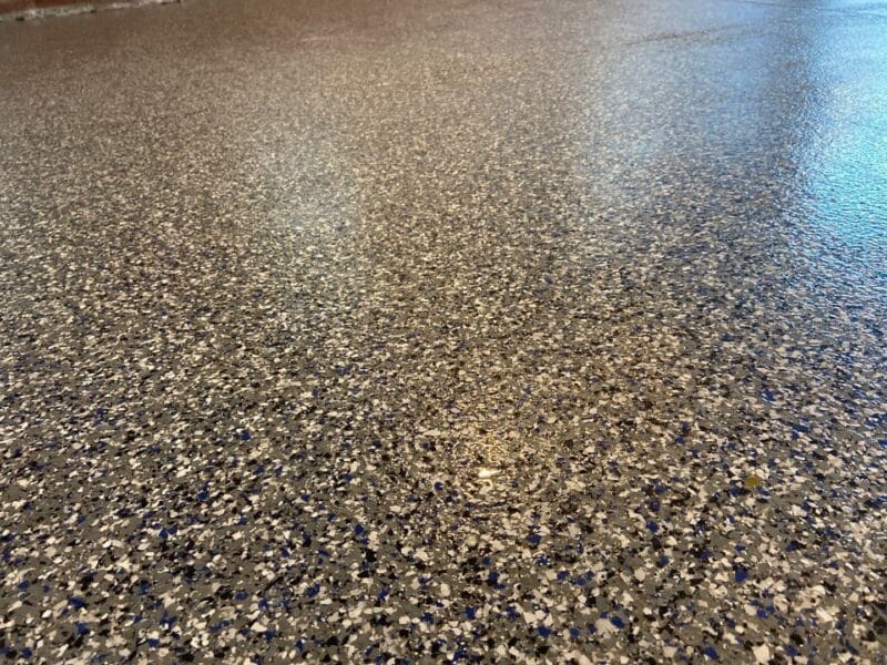 closeup of decorative garage floor coating done by gleam team